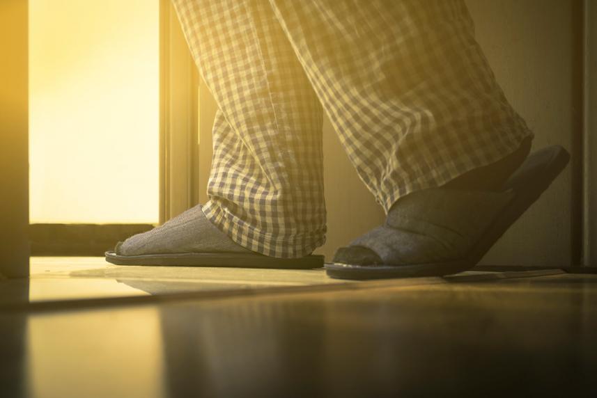Older man walking to the bathroom
