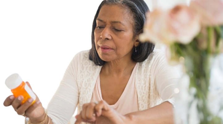 A women reviewing the details on her rx pill bottle