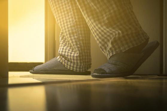 Older man walking to the bathroom